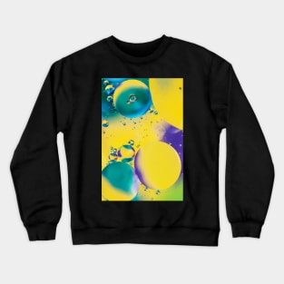 Colorful close up of oil drops in water Crewneck Sweatshirt